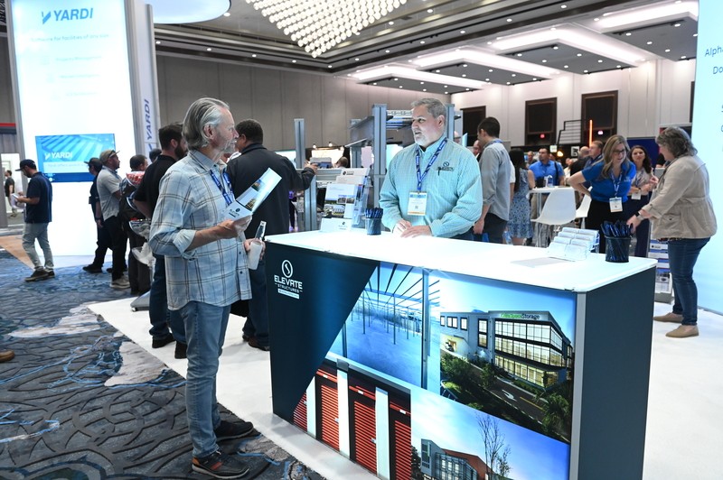 Attendees making a deal with an exhibitor