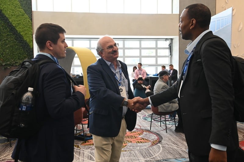 Two Attendees Shaking Hands