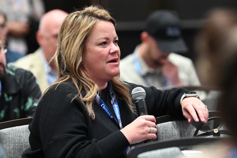 Attendee asking questions at ISS World Expo